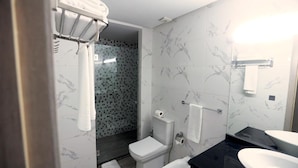 A modern bathroom with a toilet, shower, and sink. - Hotel Belle VUE Meknes (Meknes)