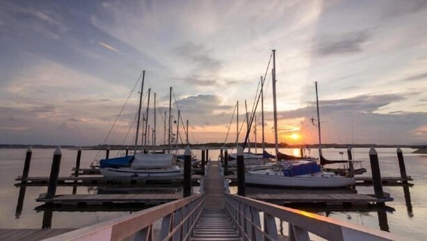 A pier leading to a marina with several boats docked. - S Bee Hotel (Johor Bahru)
