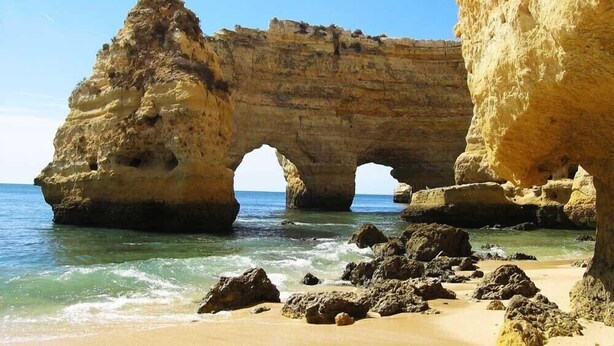 A coastal rock formation with a natural arch over the sea. - Large private villa, saltwater pool, great holiday in the Algarve (Carvoeiro)