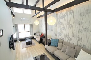 Standaard kamer | Woonkamer | Flatscreentelevisie