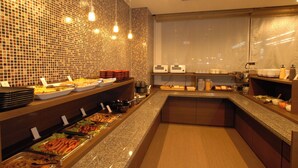 A buffet area with various food stations, a tiled backsplash, and a large window. - AB Hotel Fukaya (Fukaya)