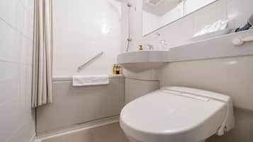 Combined shower/tub, free toiletries, hair dryer, slippers