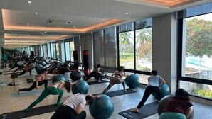 A spacious gym with large windows and exercise balls. - Seastar Hotel And Service Apartment (Ban Chang)