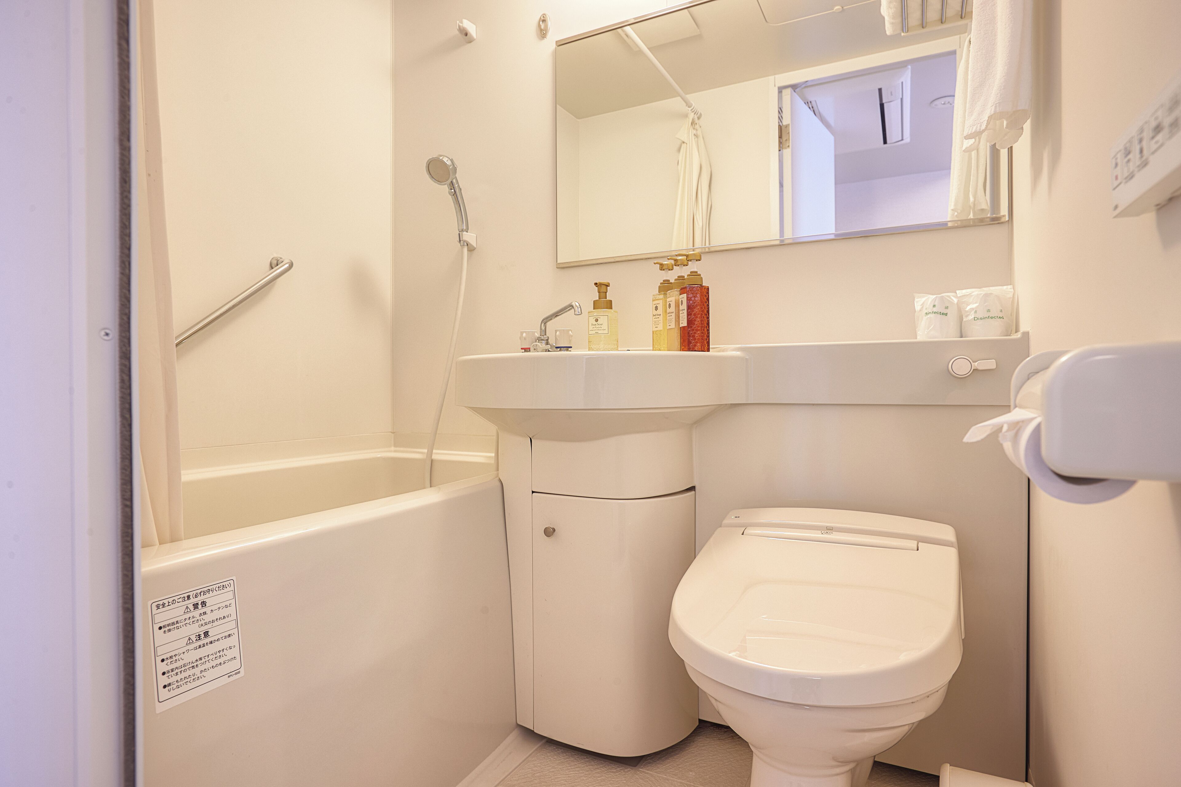 deluxe twin room | bathroom | shower, free toiletries, hair dryer, slippers
