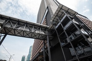 A modern building with a prominent metal framework and large windows. - KL Bangsar Sentral (EST) (Kuala Lumpur)