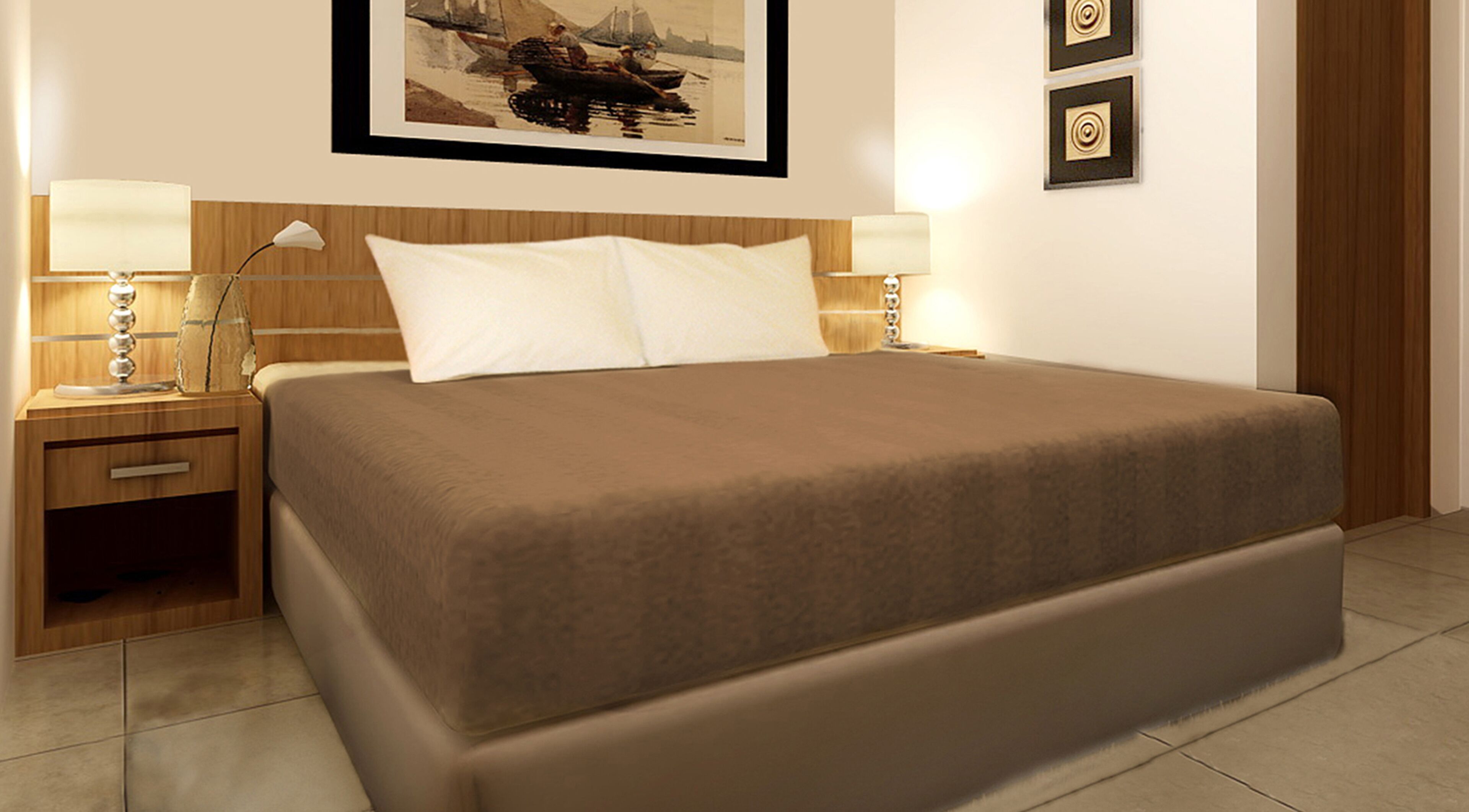 A hotel room with a large bed, two bedside tables with lamps, a framed picture on the wall, and a wooden door.