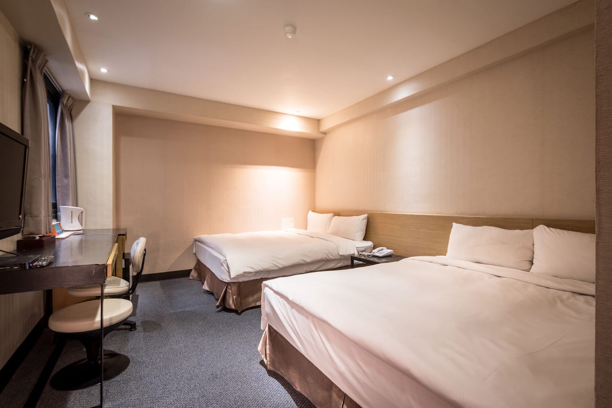 Family Room | Down comforters, desk, blackout drapes, soundproofing