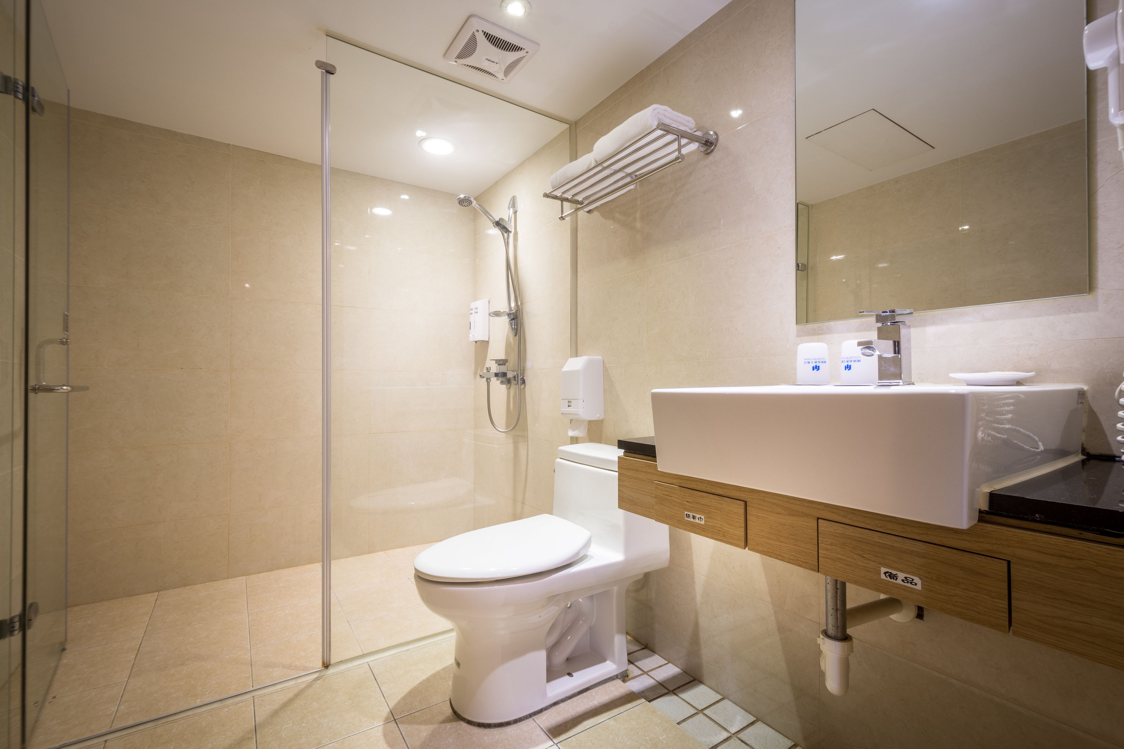 deluxe double room | bathroom | shower, hair dryer, slippers, towels