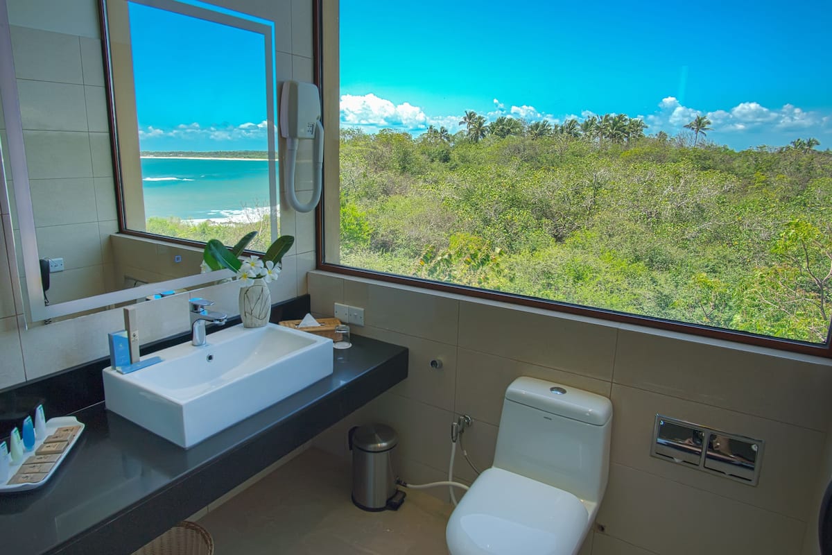 luxury room with panoramic sea view | bathroom | shower, free toiletries, hair dryer, bathrobes