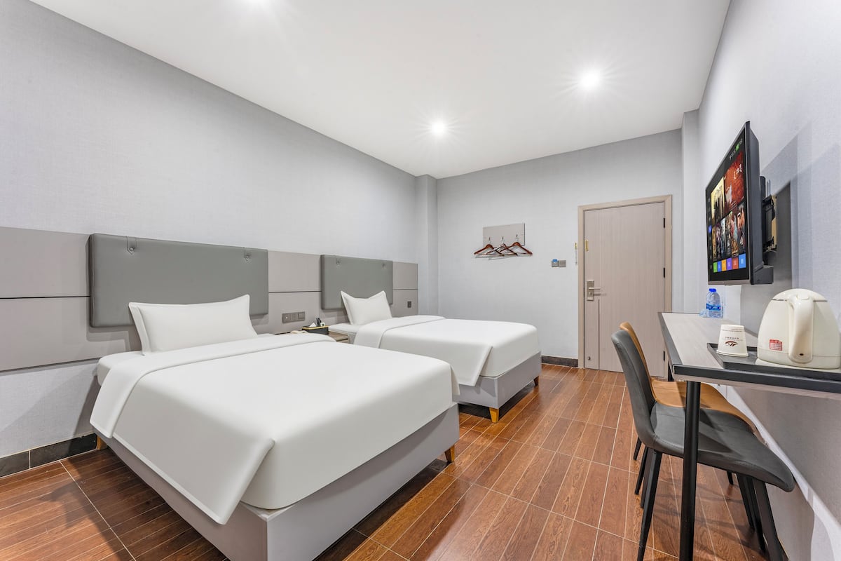 Business Twin kamer | Een minibar, een bureau, verduisterende gordijnen, gratis wifi