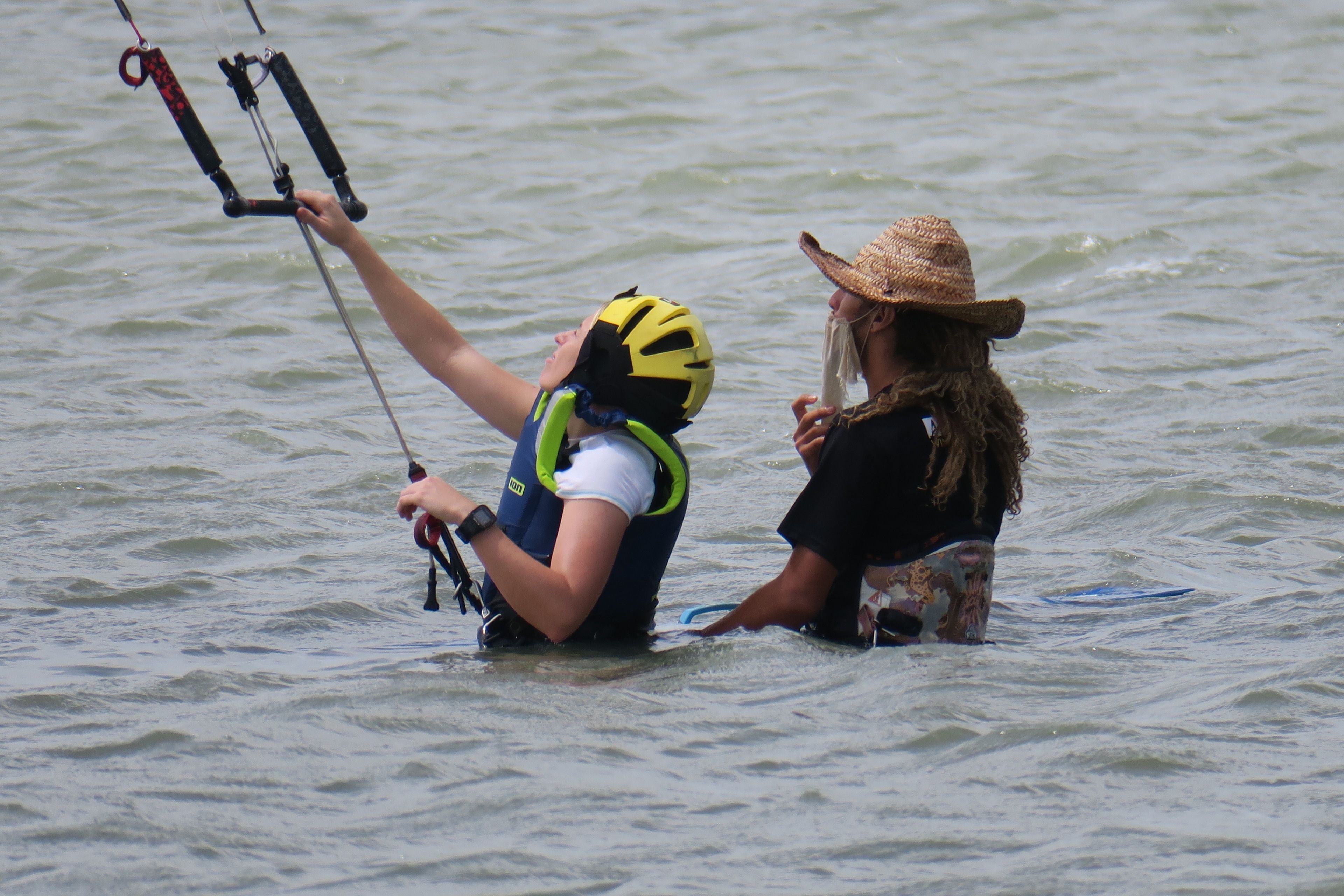 A person in a kayak on a body of water.