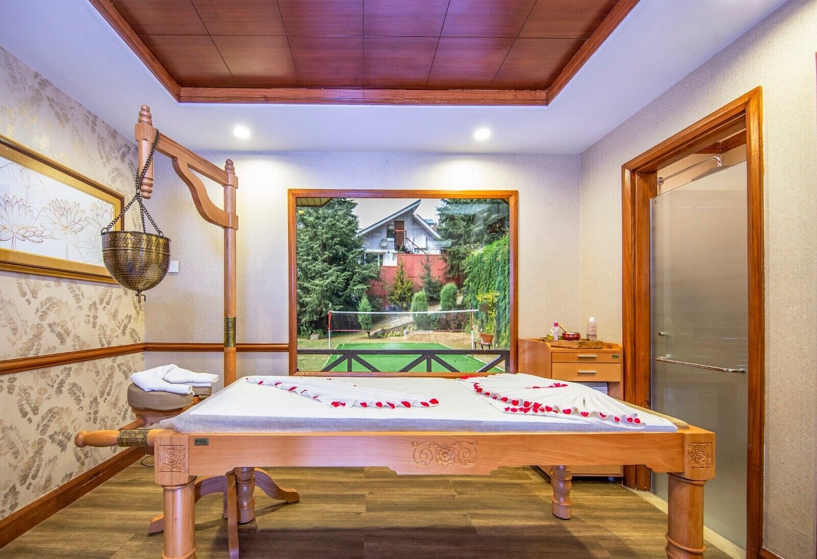 A room with a wooden bed, a wooden bench, a hanging bathrobe, a wooden bench with a towel, a wooden bench with a towel, a wooden bench with a towel, a wooden bench with a towel, a wooden bench with a towel, a wooden bench with a towel, a wooden bench with a towel, a wooden bench with a towel, a wooden bench with a towel, a wooden bench with a towel, a wooden bench with a towel, a wooden bench with a towel, a wooden bench with a towel, a wooden bench with a towel, a wooden bench with a towel, a wooden bench with a towel, a wooden bench with a towel, a wooden bench with a towel, a wooden bench with a towel, a wooden bench with a towel, a wooden bench with a towel, a wooden bench with a towel, a wooden bench with a towel, a wooden bench with a towel, a wooden bench with a towel, a wooden bench with a towel
