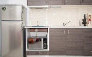 Apartment, 1 Bedroom | Private kitchen | Fridge, oven, stovetop, coffee/tea maker