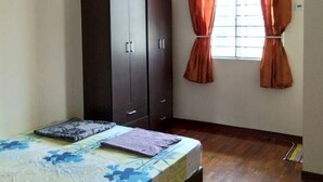 A bedroom with a bed, wardrobe, window with curtains, ceiling fan, and air conditioning unit. - Nadrah Putrajaya Homestay (Putrajaya)