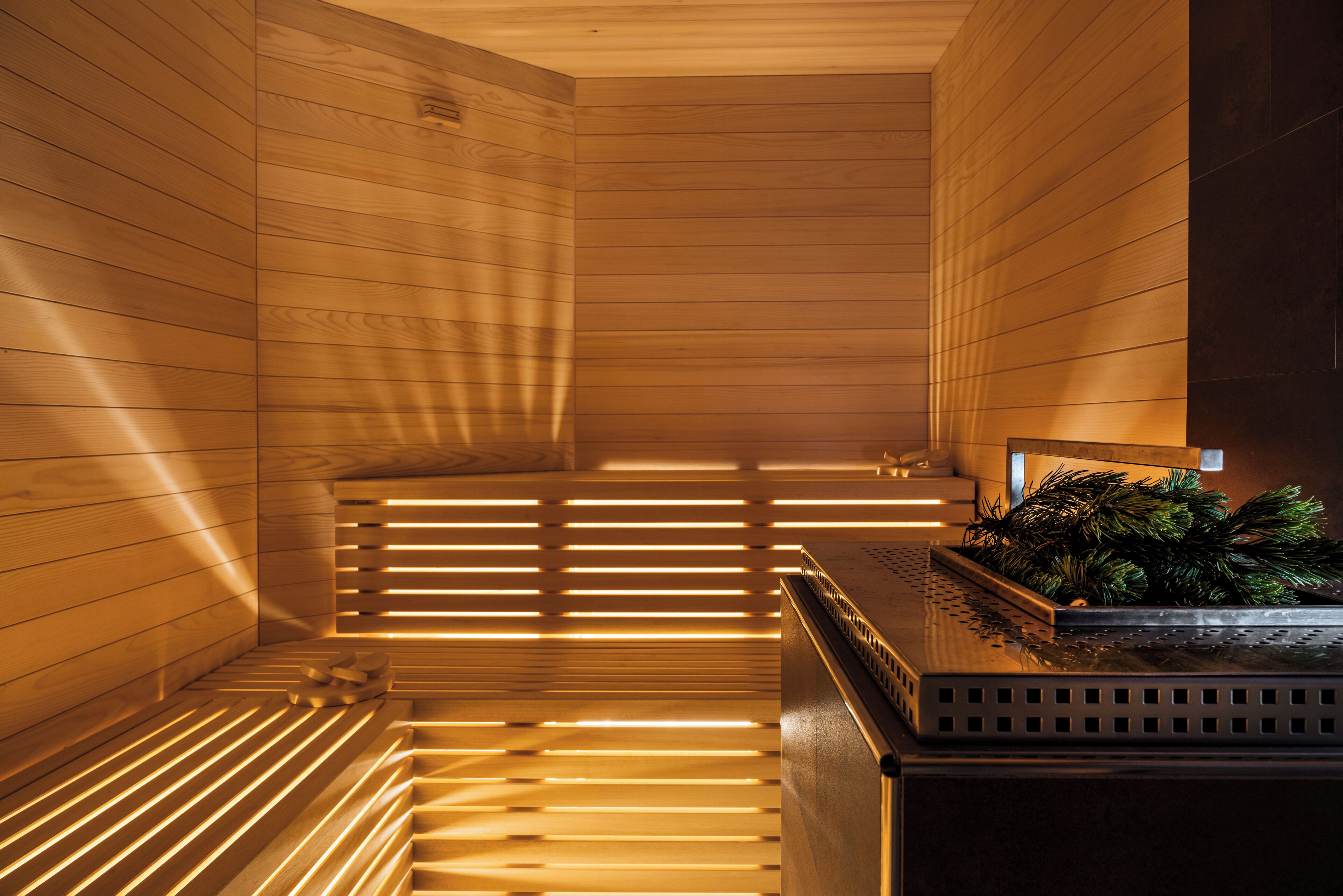 A sauna with wooden walls and slatted benches.
