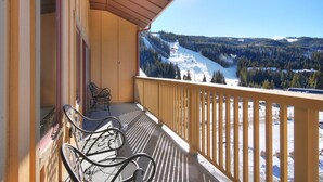 A balcony with a view of a snowy mountain landscape. - 2296 Red Hawk Lodge 2 Bedroom Condo by RedAwning (Keystone)