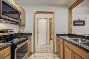 Condo, 2 Bedrooms | Private kitchen | Full-size fridge, microwave, oven, stovetop