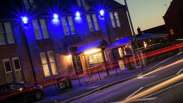 A building with multiple windows and a sign that reads "The PORTLAND". - The Portland Hotel (Ashington)