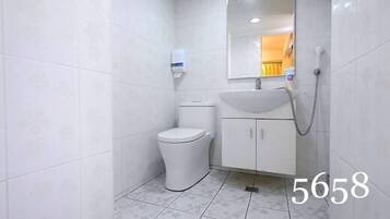 Economy Double Room | Bathroom | Shower, free toiletries, hair dryer, slippers