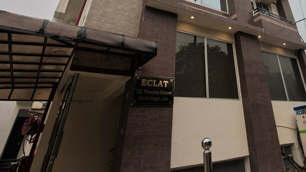 A building with a sign reading "ECLAT 32, Vinamra Khand Gomti Nagar, Lko." - Eclat Suites Mint Gomti Nagar (Lucknow)