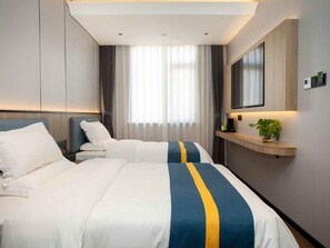 A hotel room with two beds, a flat-screen TV, a bedside table, and a large window with curtains. - Greentree Alliance Nicheng Nanlu Rd. Renmin Rd. Ho (Shanghai)