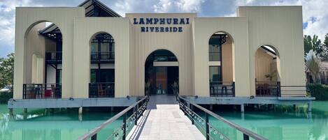 A building with a sign reading "LAMPHURAI RIVERSIDE".