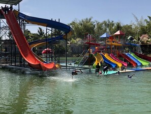 A water park with multiple colorful slides and a pool area. - Lamphurai Riverside Resort and Spa (Khao Saming)
