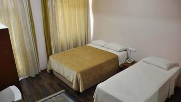 Triple Room | Premium bedding, minibar, in-room safe, desk