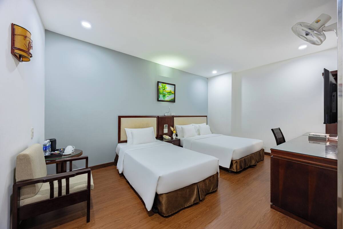 Family Triple Room | Minibar, in-room safe, iron/ironing board, free WiFi