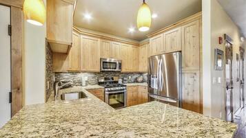 Condo, 2 Bedrooms | Private kitchen | Microwave, oven, coffee/tea maker, cookware/dishes/utensils