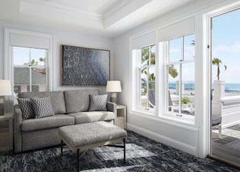 Oceanfront Horizon Cottage | Living area | 55-inch Smart TV with cable channels, fireplace, Netflix at Beach Village at The Del, LXR Hotels & Resorts