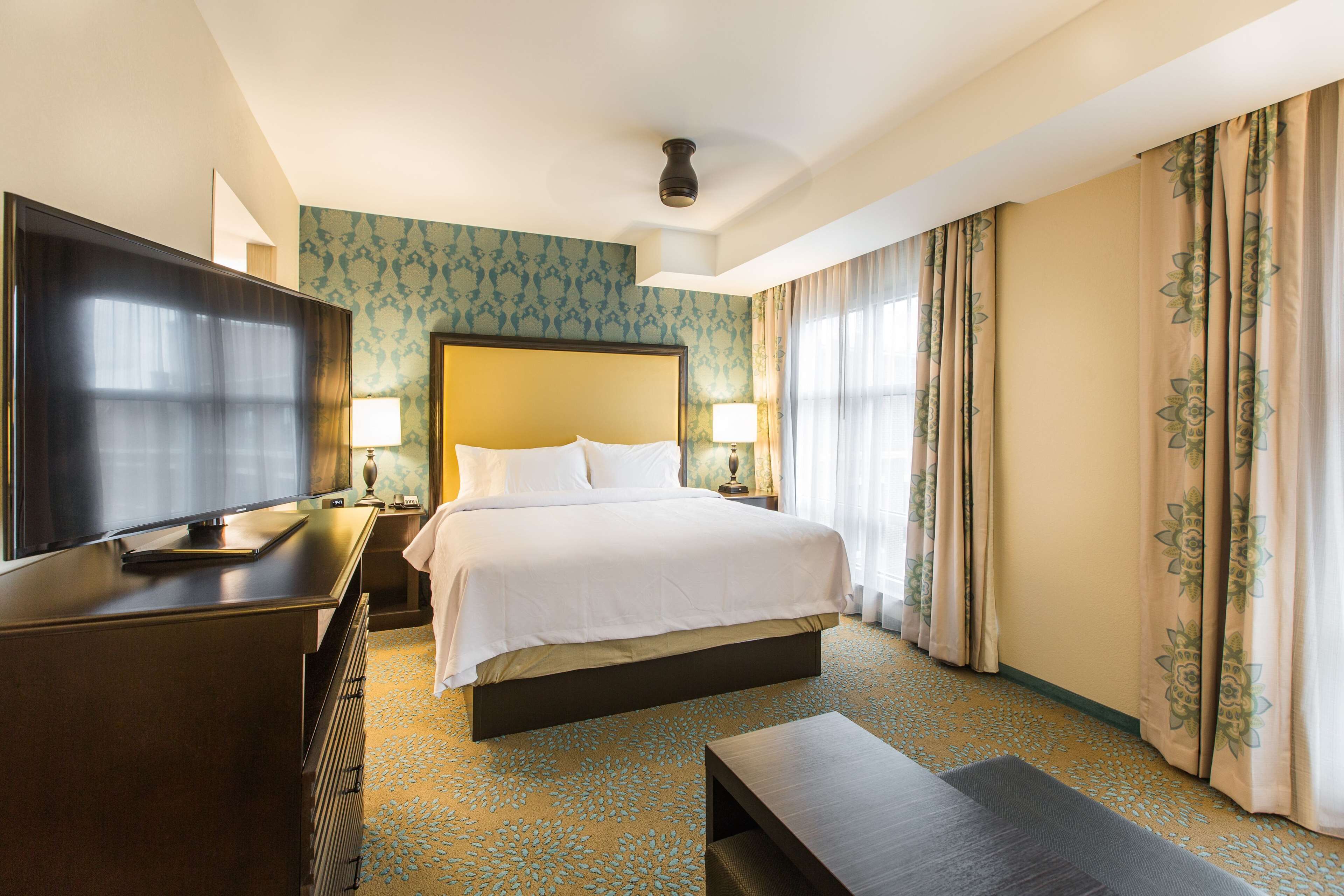 premium bedding, desk, laptop workspace, blackout curtains