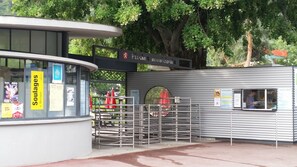 A small, enclosed building with a sign reading "Pessac Monastery." - Motel Des Sports (Martigny)