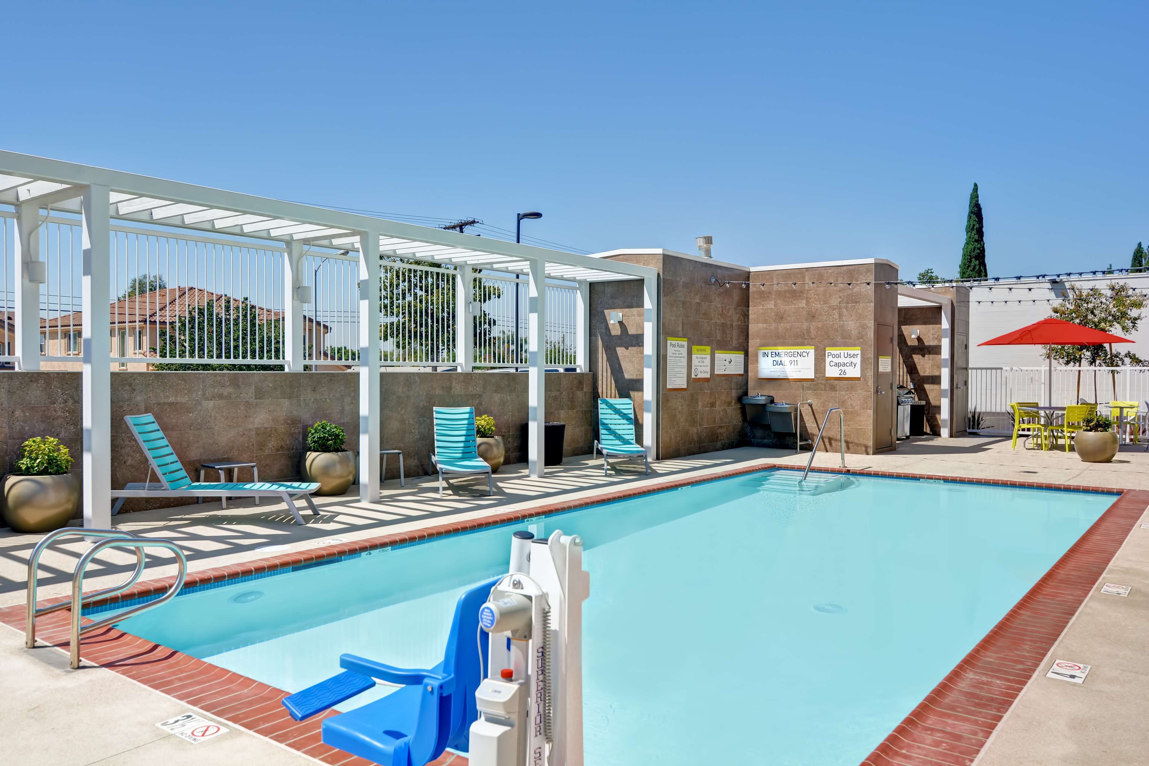 outdoor pool, open 6 am to 10 pm, pool umbrellas