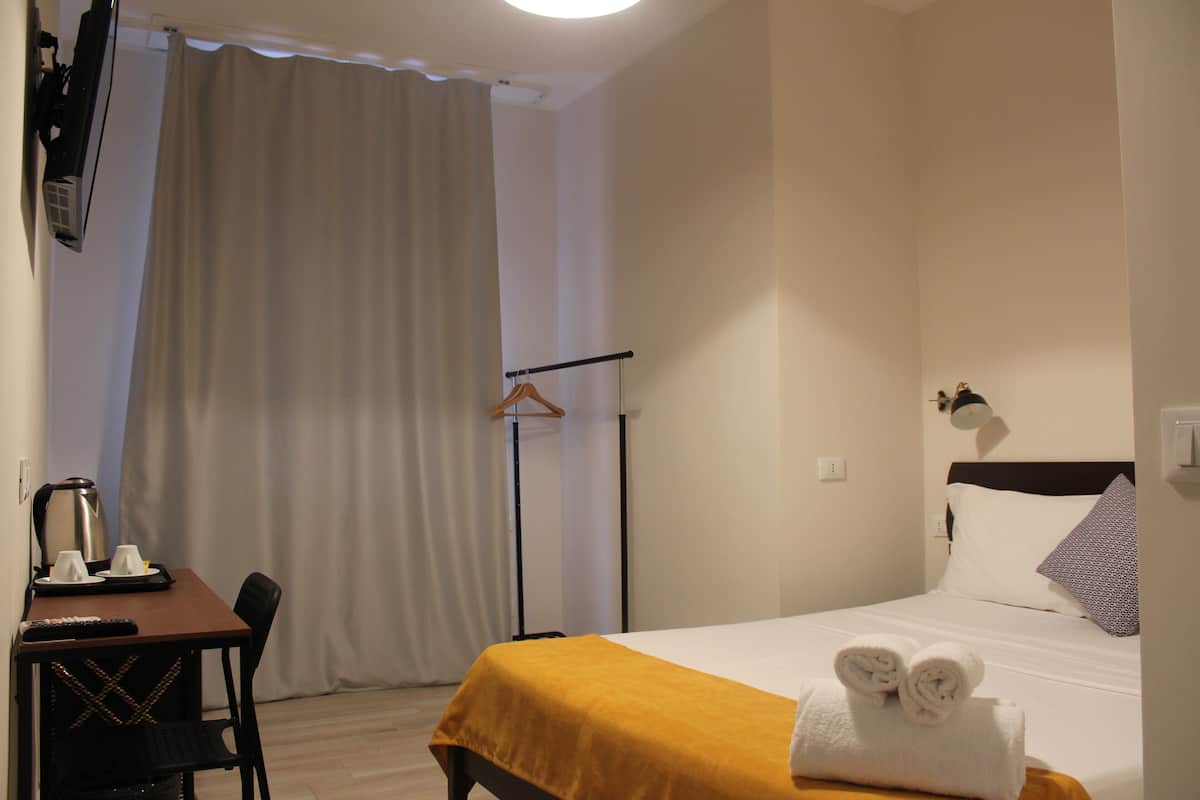 Economy tweepersoonskamer | 1 slaapkamer, een strijkplank/strijkijzer, gratis wifi