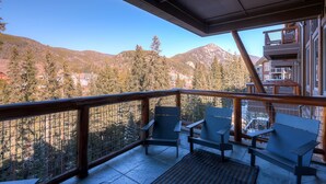 A balcony with chairs and a view of mountains. - Luxury 4bdr Ski In-out /premium Amenities 4 Bedroom Condo by RedAwning (Keystone)