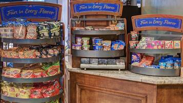 A snack display with various chips and cereals.