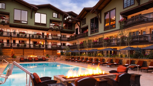 A hotel with a pool area, outdoor seating, and a fire feature. - 2 BR Condo at The Lodge at Vail View of Gore Range by RedAwning - Save 20% on 7+ Nights! (Vail)