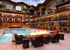 A hotel with a pool area, outdoor seating, and a fire feature. - 2 BR Condo at The Lodge at Vail View of Gore Range by RedAwning - Save 20% on 7+ Nights! (Vail)