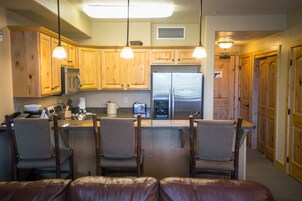 Condo, 2 Bedrooms | Private kitchen | Full-size fridge, microwave, oven, stovetop