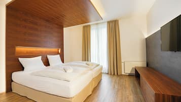 Suite Superior, pemandangan kebun | Meja kerja, kedap suara, Wi-Fi gratis, dan seprai linen