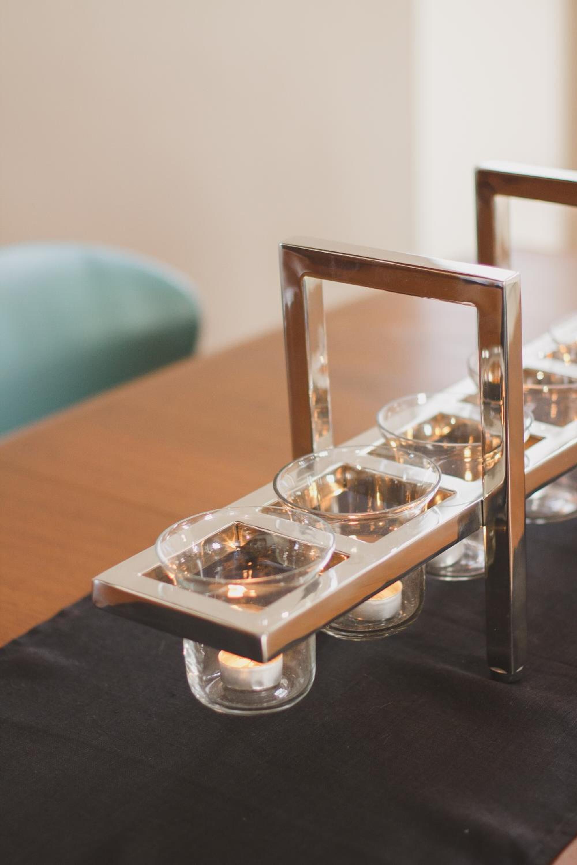 A table with a candle holder containing multiple candles.