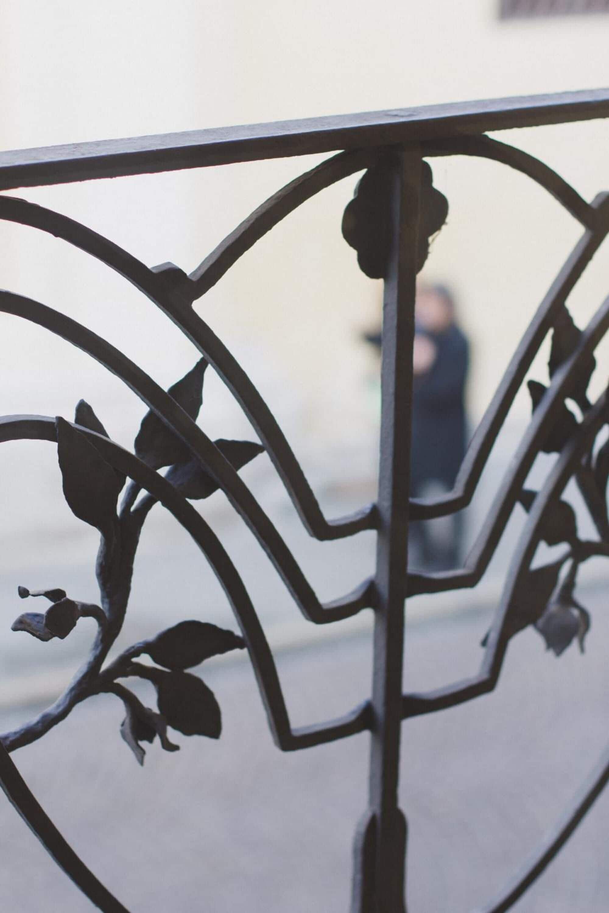 A metal railing with a floral design.
