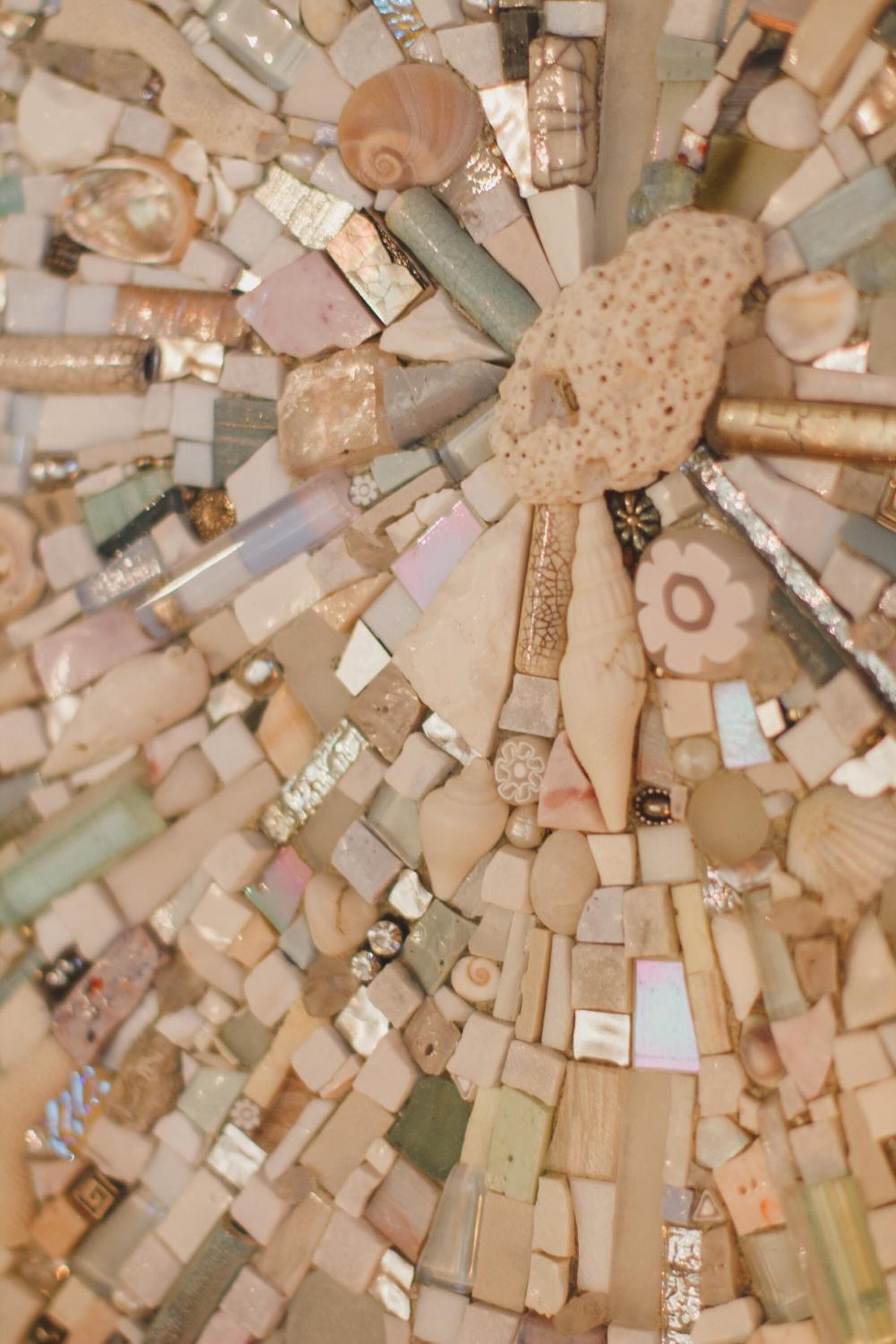 A mosaic artwork with various shapes and textures.