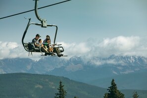 A chairlift with passengers. - 5br/5ba , Ski In/out In Arrowhead, 3523 Sq Ft! 5 Bedroom Condo by RedAwning (Edwards)