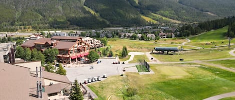 A mountain lodge with a pool, guest rooms, and a ski lift area.