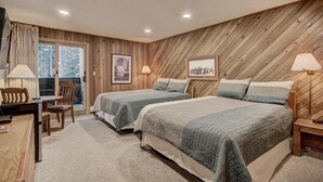 A bedroom with two beds, a desk, and chairs. - CM112H Copper Mtn Inn Studio Studio Bedroom 1Bathroom Hotel Room (Copper Mountain)