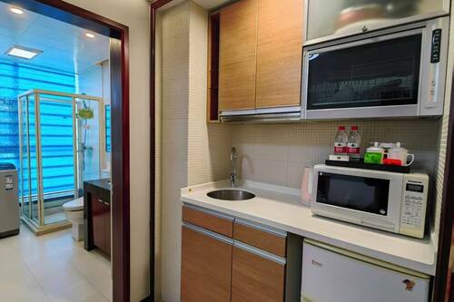Fridge, microwave, electric kettle, cookware/dishes/utensils