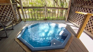 A hot tub on a wooden deck with a view of a natural landscape. - Bald Mountain House Inn at the Wolf Laurel Resort (Mars Hill)
