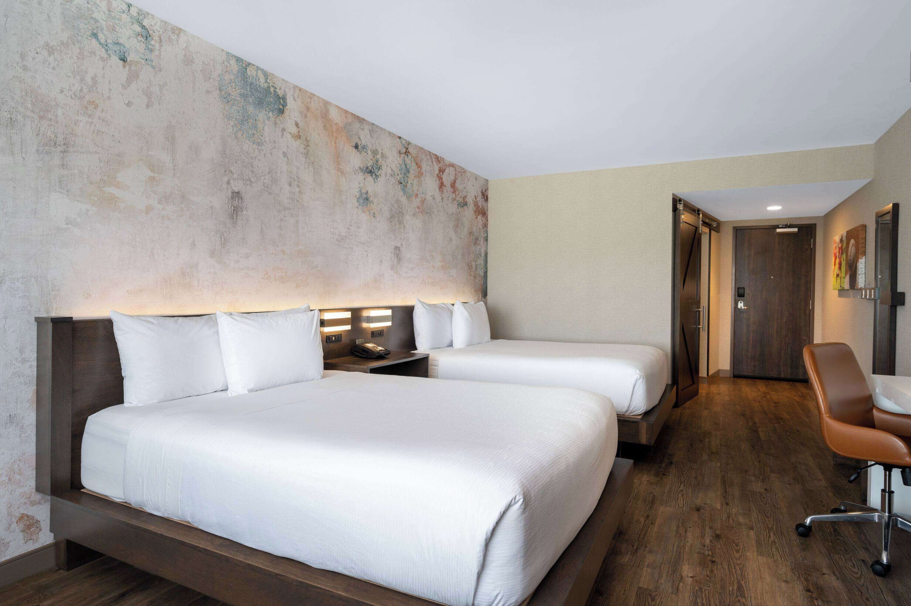 room, 2 queen beds, non smoking | premium bedding, desk, iron/ironing board, free cots/infant beds